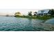 Scenic waterfront featuring a boat house, pier, and a variety of colorful kayaks available for recreational use at 2578 Helmsman Rd, Johns Island, SC 29455