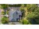 An aerial view shows a private backyard deck with outdoor seating and mature trees at 2645 Crooked Stick Ln, Mount Pleasant, SC 29466