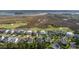 Aerial view of attractive neighborhood with diverse architecture and beautiful marshland in background at 2645 Crooked Stick Ln, Mount Pleasant, SC 29466