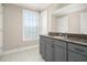 Bathroom showcasing granite vanity with a single sink and large mirror at 2645 Crooked Stick Ln, Mount Pleasant, SC 29466