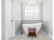 Spa-like bathroom features a freestanding tub, modern fixtures, and elegant tile work for a luxurious experience at 2645 Crooked Stick Ln, Mount Pleasant, SC 29466