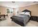 Bedroom featuring neutral carpet, natural light, and a dark wood bed set at 2645 Crooked Stick Ln, Mount Pleasant, SC 29466