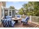 Outdoor deck featuring a cozy seating area with a fire pit, ideal for entertaining or enjoying quiet evenings at 2645 Crooked Stick Ln, Mount Pleasant, SC 29466