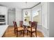 Bright dining area featuring a glass table, seating for six, and natural light from large windows at 2645 Crooked Stick Ln, Mount Pleasant, SC 29466