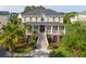 Charming two-story home with a welcoming front porch and beautifully landscaped yard at 2645 Crooked Stick Ln, Mount Pleasant, SC 29466