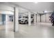 Spacious garage with epoxy floors, modern lighting, and ample parking at 2645 Crooked Stick Ln, Mount Pleasant, SC 29466