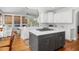 Bright, modern kitchen with white cabinets, island, and stainless steel appliances at 2645 Crooked Stick Ln, Mount Pleasant, SC 29466