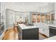 Bright and open kitchen featuring a central island and a sunlit breakfast nook with large windows at 2645 Crooked Stick Ln, Mount Pleasant, SC 29466