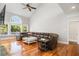 Spacious living room featuring high ceilings, hardwood floors, and large windows offering abundant natural light at 2645 Crooked Stick Ln, Mount Pleasant, SC 29466