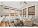 Inviting sunroom features large windows, comfortable seating, and a ceiling fan for a bright and airy atmosphere at 2645 Crooked Stick Ln, Mount Pleasant, SC 29466