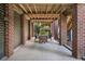 Spacious covered patio with elegant dining area, providing a cool and shaded space for relaxation and entertainment at 2645 Crooked Stick Ln, Mount Pleasant, SC 29466