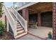 Outdoor patio with stairs leading up, featuring a dining area for outdoor entertaining beneath the raised deck at 2645 Crooked Stick Ln, Mount Pleasant, SC 29466