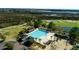Aerial view of a large community pool with lush landscaping and nearby playground at 2645 Crooked Stick Ln, Mount Pleasant, SC 29466