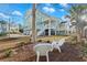 Expansive backyard features mature trees, lush lawn and a view of the home's multiple decks at 2924 Tranquility Rd, Mount Pleasant, SC 29466
