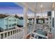 Comfortable porch swing on balcony with community views and beautiful evening skies at 2924 Tranquility Rd, Mount Pleasant, SC 29466