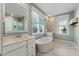 Bright bathroom features dual vanity sinks, freestanding tub, glass shower, and marble flooring at 2924 Tranquility Rd, Mount Pleasant, SC 29466