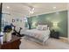 Comfortable bedroom with exercise bike, neutral walls, ceiling fan, and large window with natural light at 2924 Tranquility Rd, Mount Pleasant, SC 29466