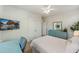 Comfortable bedroom with a TV, dresser, desk, ceiling fan, and light-colored walls at 2924 Tranquility Rd, Mount Pleasant, SC 29466