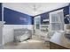 Charming Bedroom with a blue accent wall, a gray crib, and playful decor, creating a cozy atmosphere at 2924 Tranquility Rd, Mount Pleasant, SC 29466