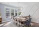 Elegant dining room showcasing natural light, hardwood floors, and stylish decor at 2924 Tranquility Rd, Mount Pleasant, SC 29466
