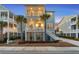 Charming two-story beach house with stairs leading to the porch and second-story deck at 2924 Tranquility Rd, Mount Pleasant, SC 29466