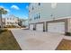 Spacious three-car garage with ample parking and an adjacent beach house at 2924 Tranquility Rd, Mount Pleasant, SC 29466