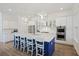 Modern kitchen featuring a blue center island with white marble countertops and stainless steel appliances at 2924 Tranquility Rd, Mount Pleasant, SC 29466