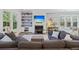 Inviting living room featuring a fireplace, hardwood floors, and large sectional sofa at 2924 Tranquility Rd, Mount Pleasant, SC 29466
