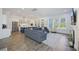 Spacious living area flows into a modern kitchen; features hardwood floors and large windows at 2924 Tranquility Rd, Mount Pleasant, SC 29466