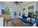 Relaxing covered patio with a ceiling fan, wood flooring, comfortable furniture, and natural light at 2924 Tranquility Rd, Mount Pleasant, SC 29466