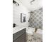 Stylish bathroom with shiplap walls, modern fixtures, and decorative tile in shower and floor at 2957 Alabama Dr, North Charleston, SC 29405