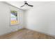 Bright, empty bedroom featuring hardwood floors, large window with natural light, and modern ceiling fan at 2957 Alabama Dr, North Charleston, SC 29405