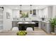 Contemporary kitchen with white cabinetry, stainless steel appliances, and an island with a breakfast bar at 2957 Alabama Dr, North Charleston, SC 29405