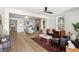Bright and airy living room featuring hardwood floors, a cozy fireplace, and stylish furnishings at 2957 Alabama Dr, North Charleston, SC 29405