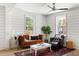Inviting living room with hardwood floors, comfortable seating, and bright windows for ample natural light at 2957 Alabama Dr, North Charleston, SC 29405