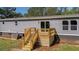 New home features a sunny wood deck with stairs, ready for entertaining or outdoor living at 314 Hickory Nut Way, Cross, SC 29436