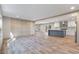 Bright, open living space flowing into a modern kitchen featuring updated flooring and natural light at 314 Hickory Nut Way, Cross, SC 29436