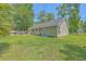 Spacious backyard with a lush lawn, mature trees, and privacy fence offers an inviting outdoor space at 333 Price St, Goose Creek, SC 29445