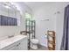 Bathroom featuring a vanity, and shower, designed for efficient use of space in a neutral design at 333 Price St, Goose Creek, SC 29445