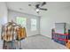 Bedroom with carpeting and fan, showing storage containers on the side of the room at 333 Price St, Goose Creek, SC 29445