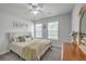 Bright bedroom with a comfortable bed and two large windows offering natural light and charm at 333 Price St, Goose Creek, SC 29445