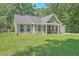 Charming home boasts a manicured lawn, neutral siding, and a welcoming entrance, complete with a black door at 333 Price St, Goose Creek, SC 29445