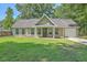 Charming home with well-manicured lawn, green door, and white trim exudes curb appeal at 333 Price St, Goose Creek, SC 29445