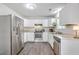 Clean kitchen with white cabinets, stainless steel appliances, and wood-look floors, creating a modern space at 333 Price St, Goose Creek, SC 29445