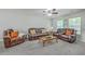 Bright living room offers comfortable seating, soft carpet, and natural light, creating an inviting atmosphere at 333 Price St, Goose Creek, SC 29445