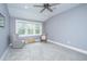 Bright bedroom with cozy chairs, neutral walls, and ample natural light at 3635 Pandora Dr, Mount Pleasant, SC 29466