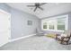 Bright bedroom with large windows, ceiling fan, and calming gray walls and plush carpeting at 3635 Pandora Dr, Mount Pleasant, SC 29466