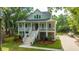 Charming two-story home with a welcoming front porch and well-maintained landscaping at 3635 Pandora Dr, Mount Pleasant, SC 29466