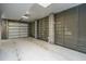 Modern garage with epoxy floor and metal roll-up door, offering ample space and durability at 3635 Pandora Dr, Mount Pleasant, SC 29466