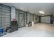 Spacious garage with gray epoxy floors, custom metal doors, and ample storage space at 3635 Pandora Dr, Mount Pleasant, SC 29466